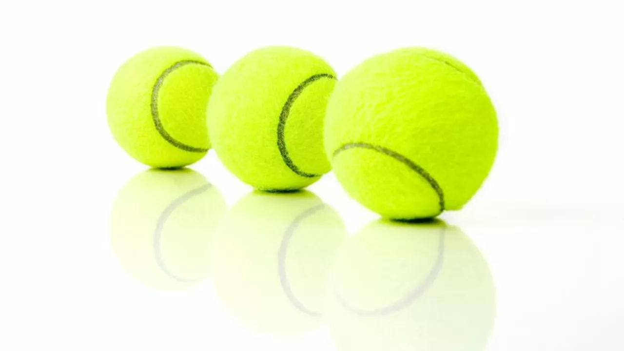 What is the official color of a tennis ball?
